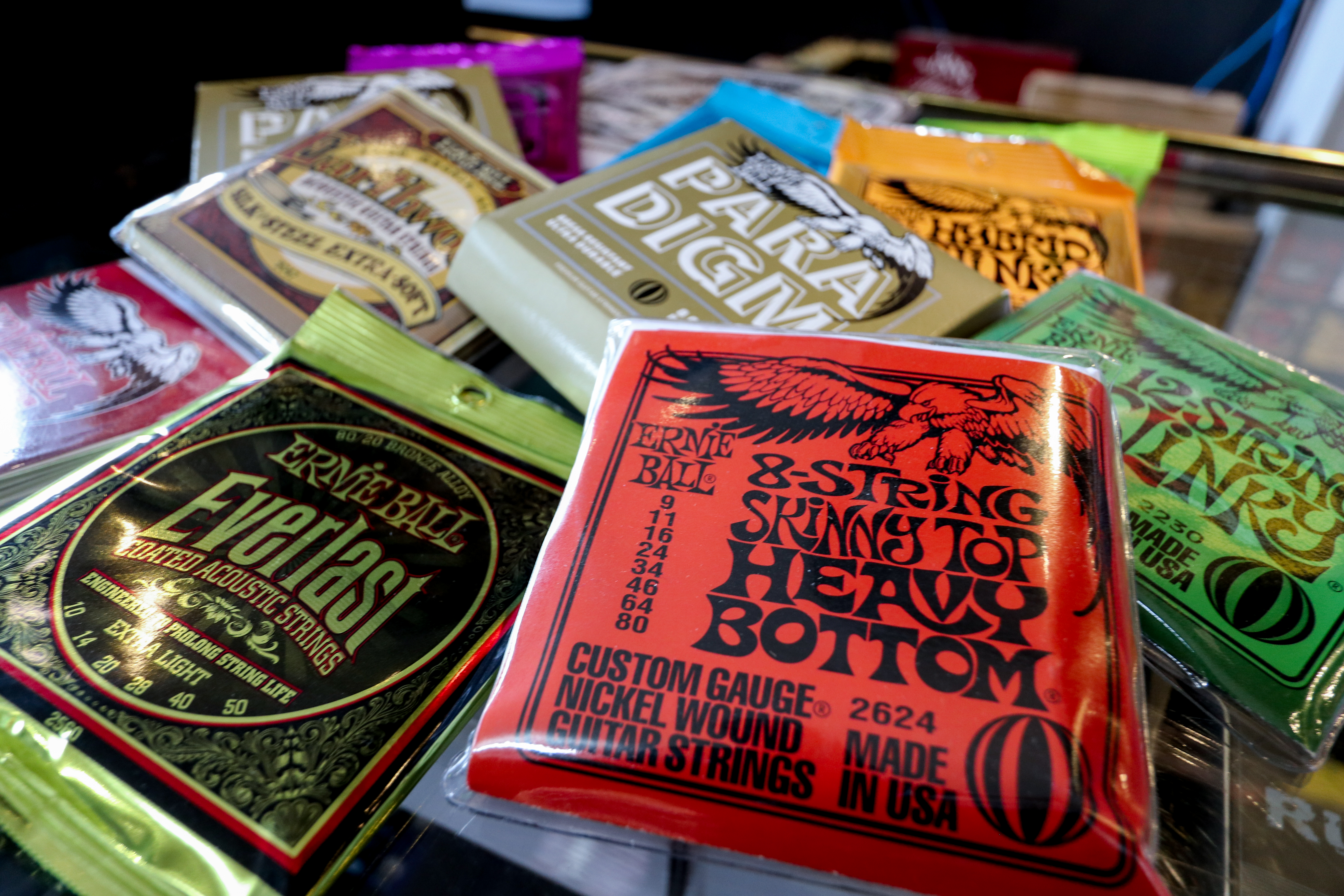 Pile of Ernie Ball string packets
