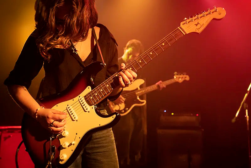 dude playing guitar on stage